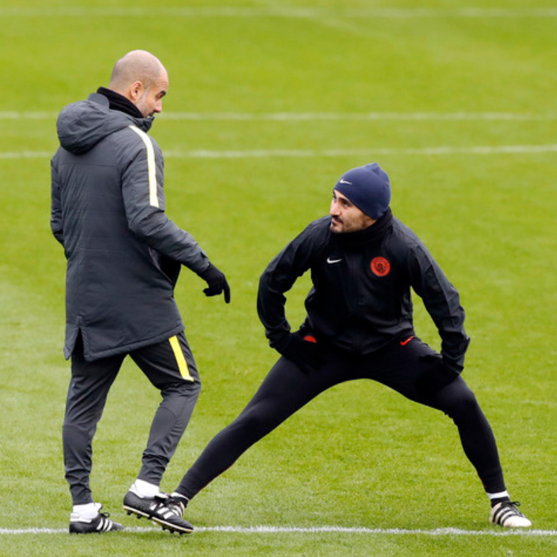Guardiola chats with Gundogan at Manchester City training football4football