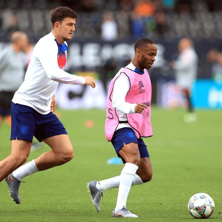 Raheem Sterling is chased by Harry Maguire during an England training session - football4football