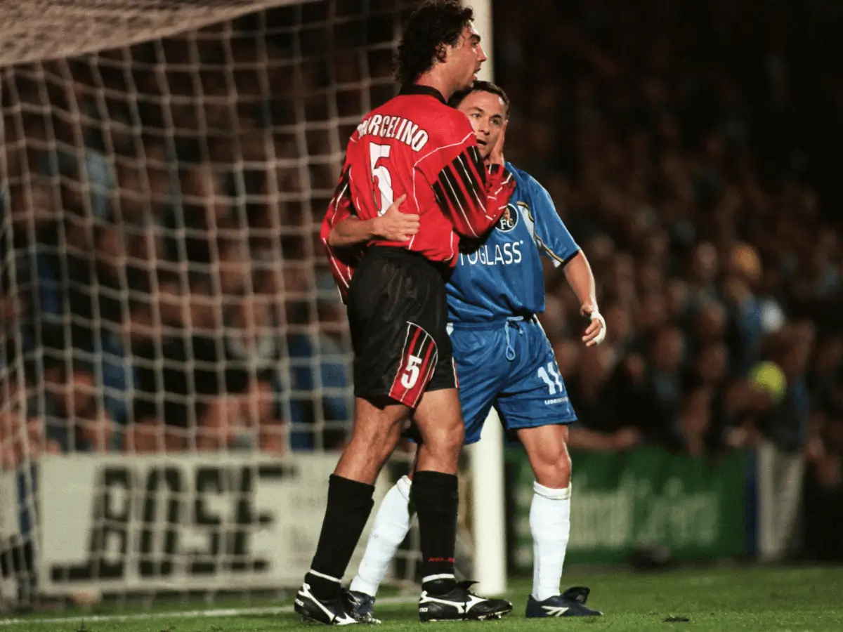 2 players embrace during a Chelsea v Mallorca football match