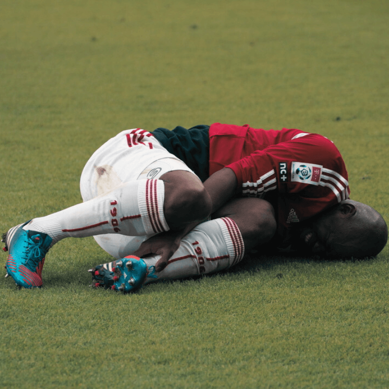 Seedorf-of-AC-Milan-lies-injured-on-the-ground-football4football